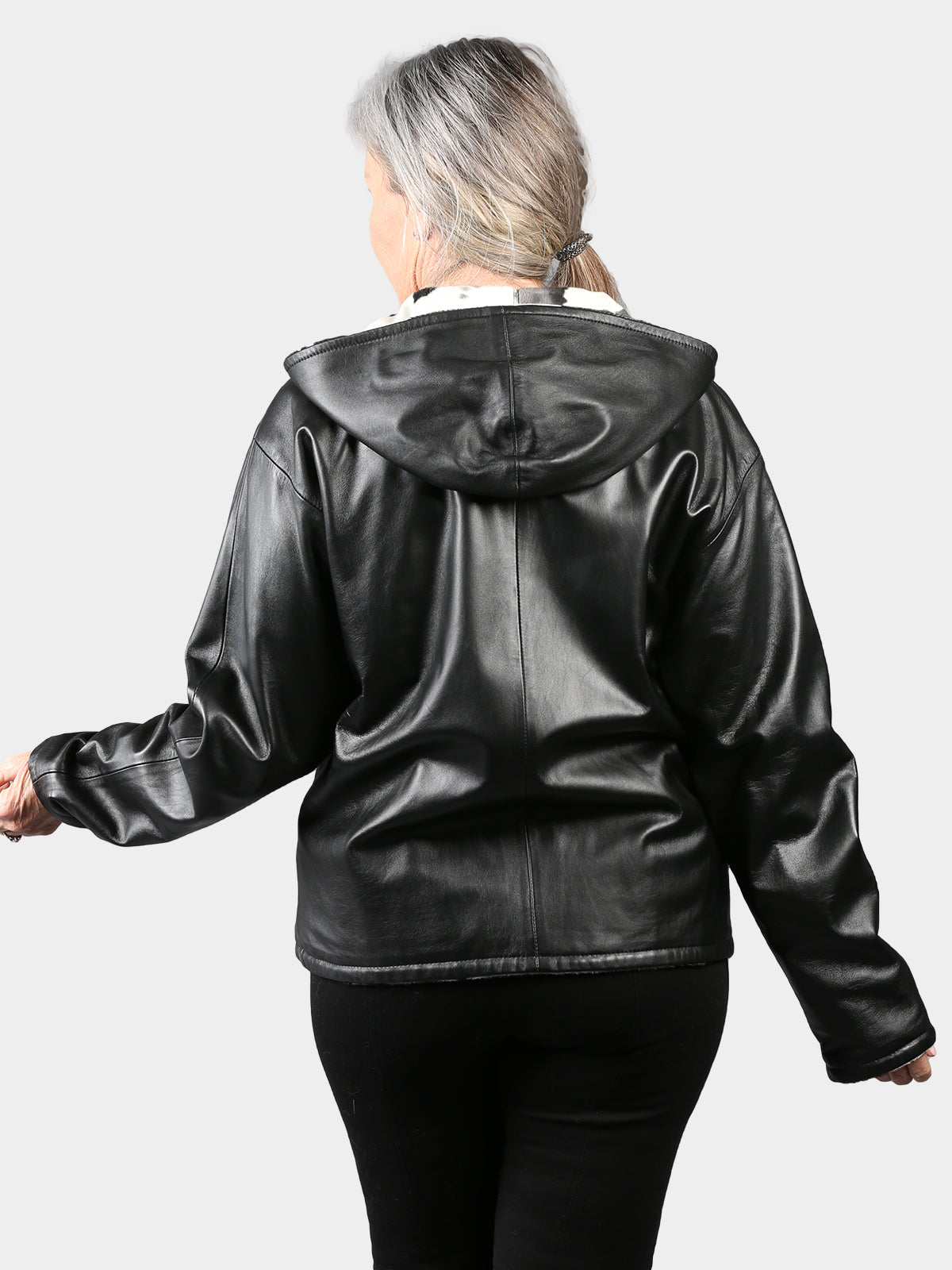 Woman's Black Hooded Leather Jacket Reversible to Cow Print Fabric