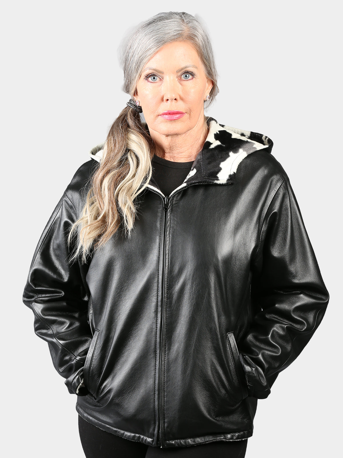 Woman's Black Hooded Leather Jacket Reversible to Cow Print Fabric