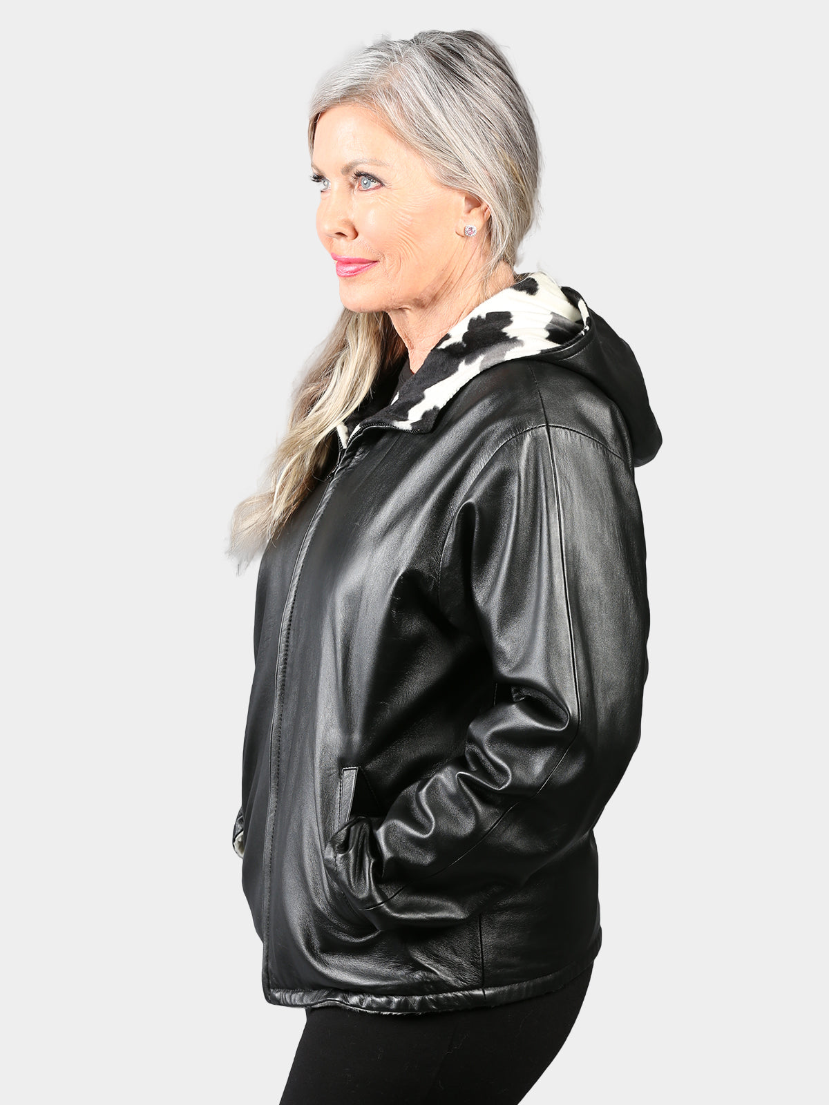 Woman's Black Hooded Leather Jacket Reversible to Cow Print Fabric